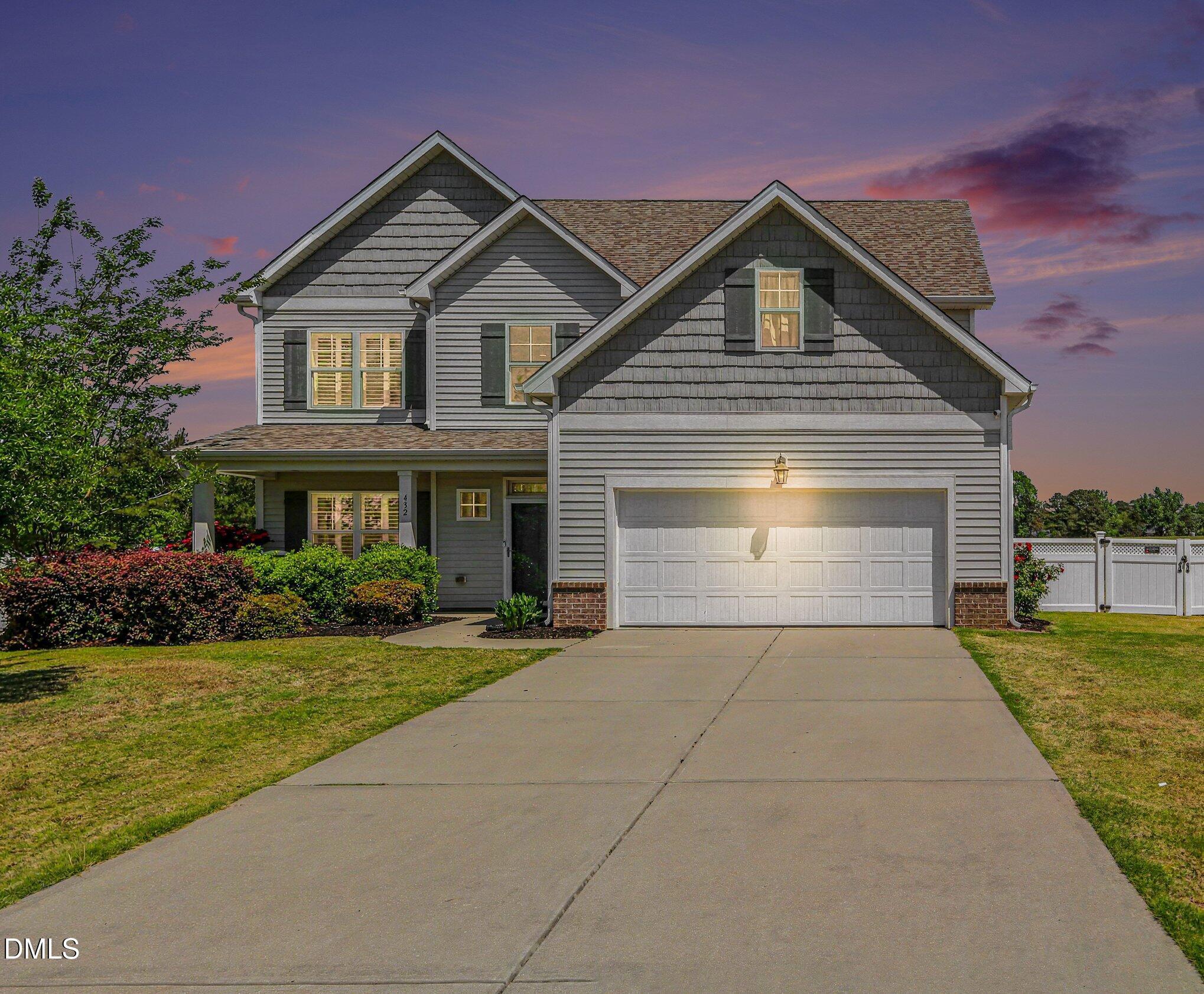 432 Seabring Lane Raleigh, NC 27603 - Photo 2 of 29 a front view of a house with a yard and garage