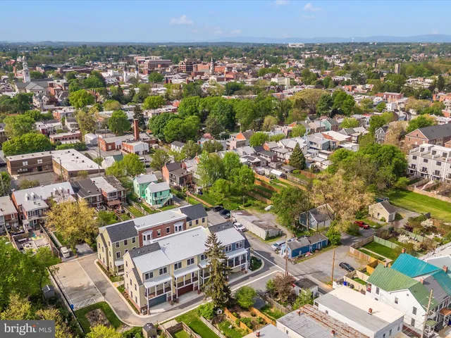 an aerial view of a city with lots of residential buildings