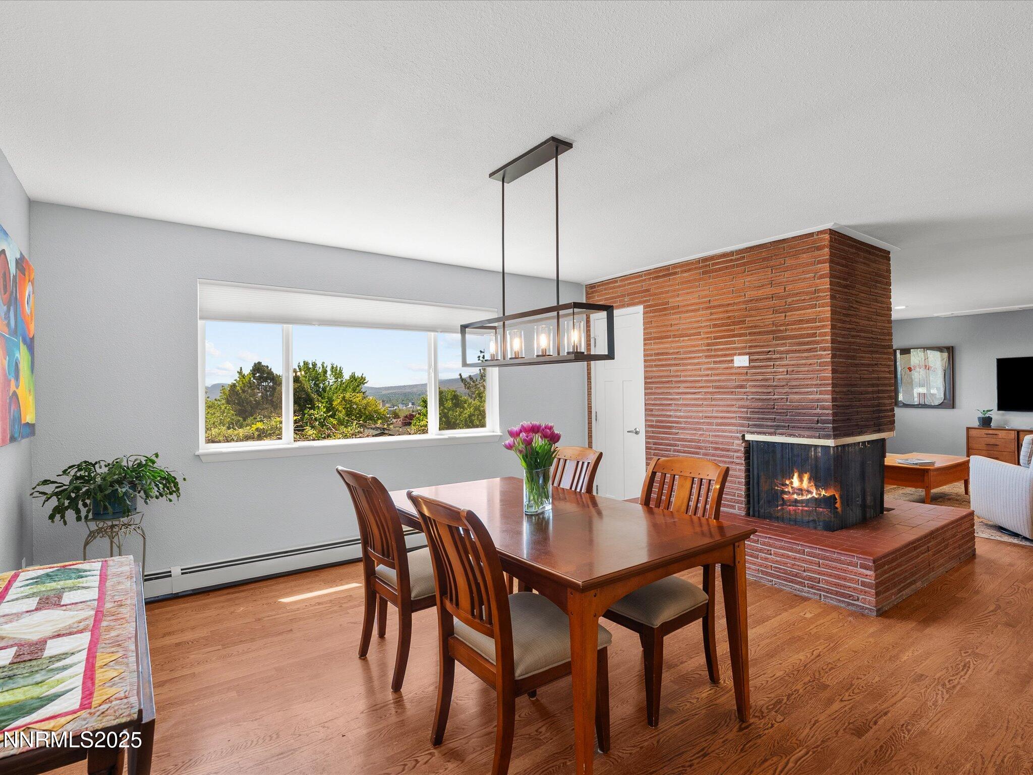60 Redstone Drive Reno, NV 89512 - Photo 17 of 61 a view of a dining room with furniture window and wooden floor