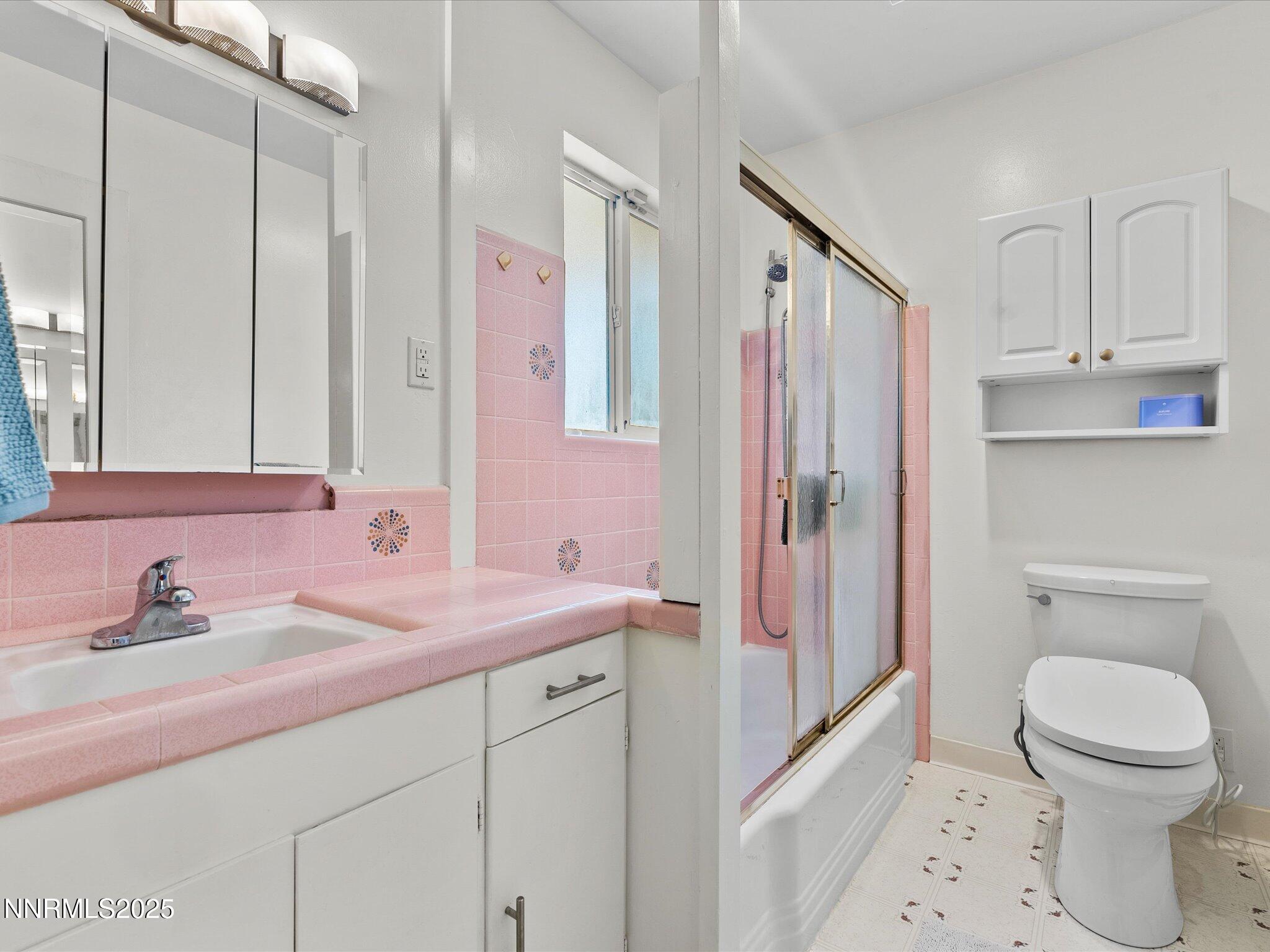 60 Redstone Drive Reno, NV 89512 - Photo 29 of 61 a bathroom with a sink a toilet and a mirror
