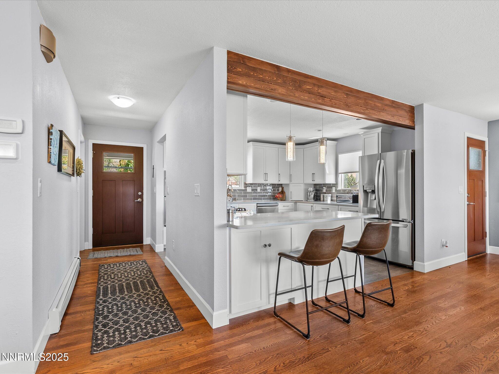 60 Redstone Drive Reno, NV 89512 - Photo 7 of 61 a view of kitchen with livingroom and microwave