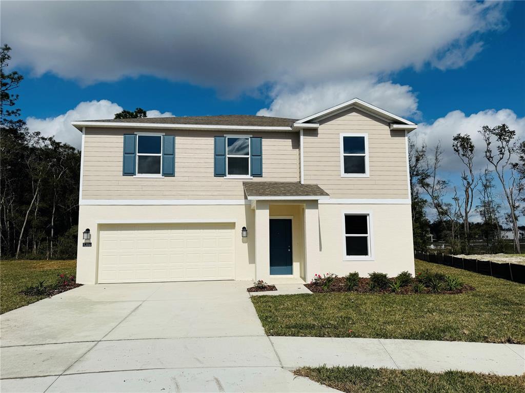1386 Inkberry Circle DeLand, FL 32720 - Photo 1 of 16 a view of white house with a yard
