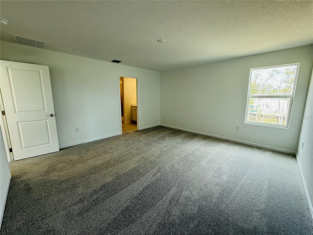 1386 Inkberry Circle DeLand, FL 32720 - Photo 11 of 16 an empty room with windows