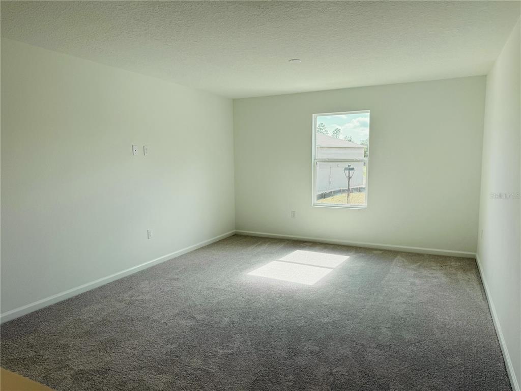 1386 Inkberry Circle DeLand, FL 32720 - Photo 14 of 16 an empty room with a window