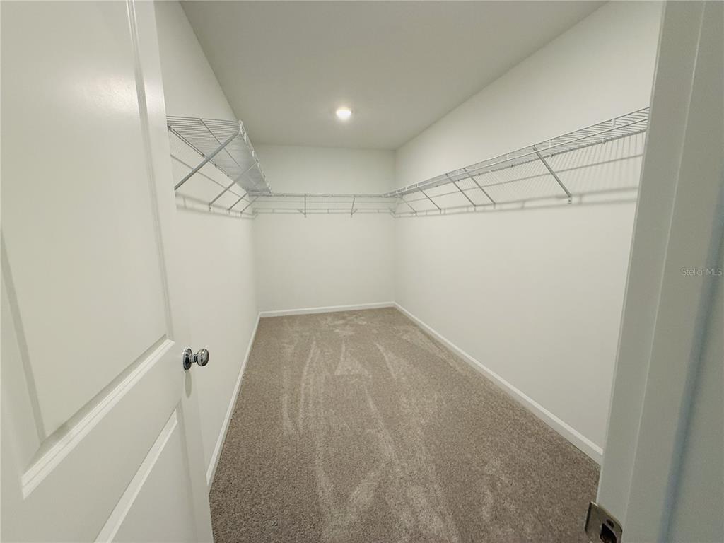 1386 Inkberry Circle DeLand, FL 32720 - Photo 10 of 16 a view of a room with racks on the wall