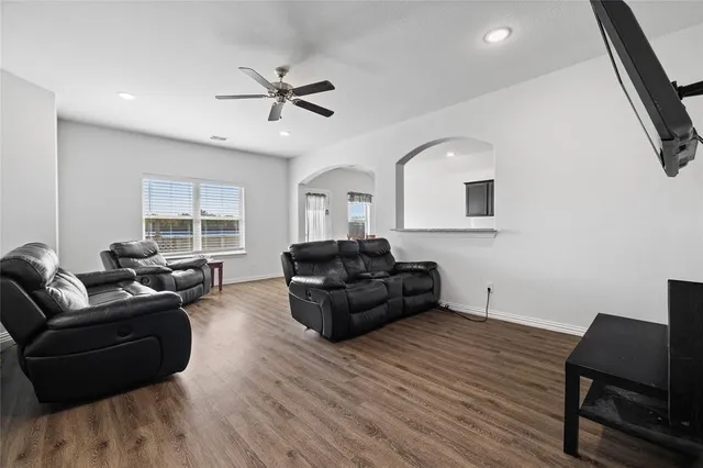 a living room with furniture and a window