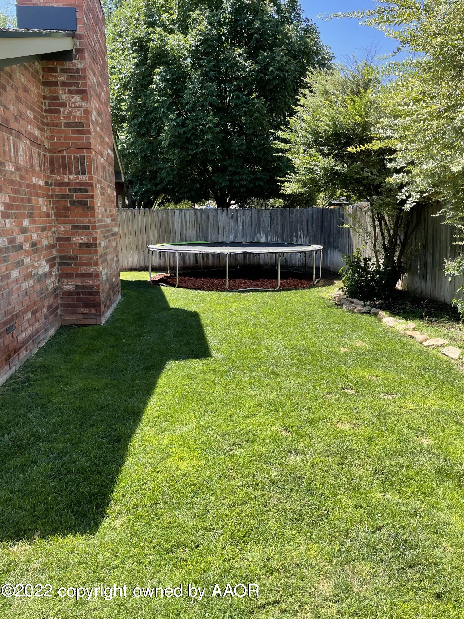 6410 Hamstead Drive Amarillo, TX 79109 - Photo 49 of 50 6410 Hamstead Backyard with tampoline