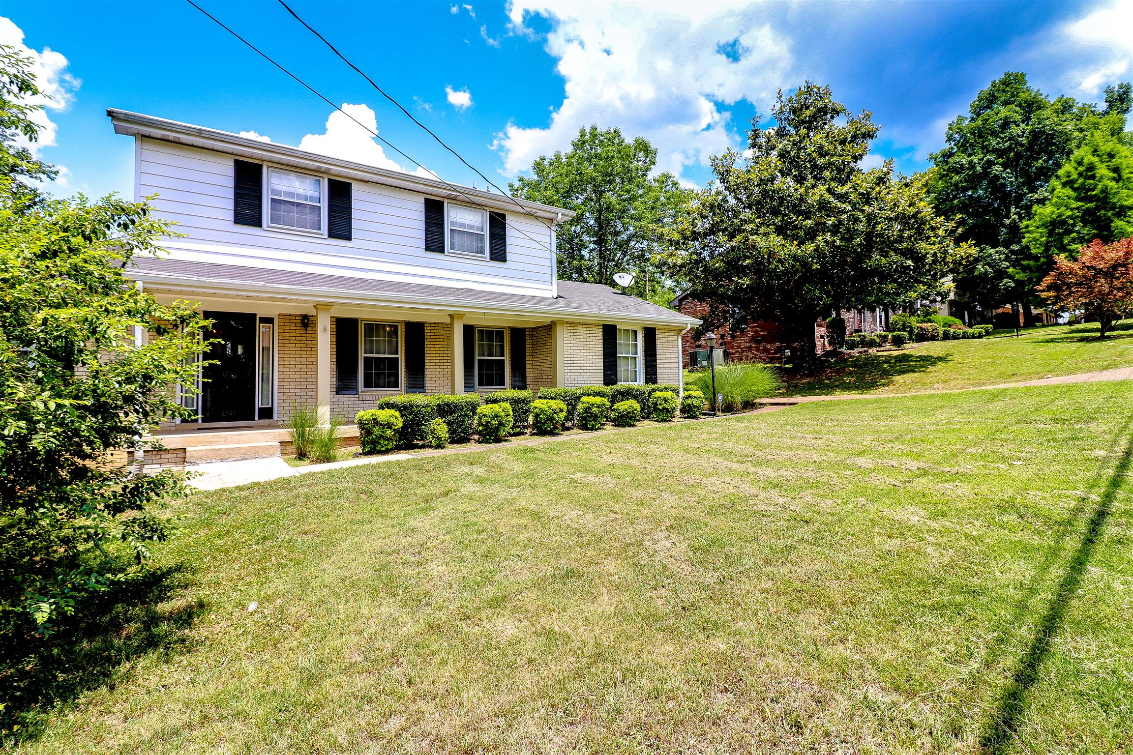 3016 Anderson Road Nashville, TN 37217 - Photo 1 of 25 a front view of a house with a yard