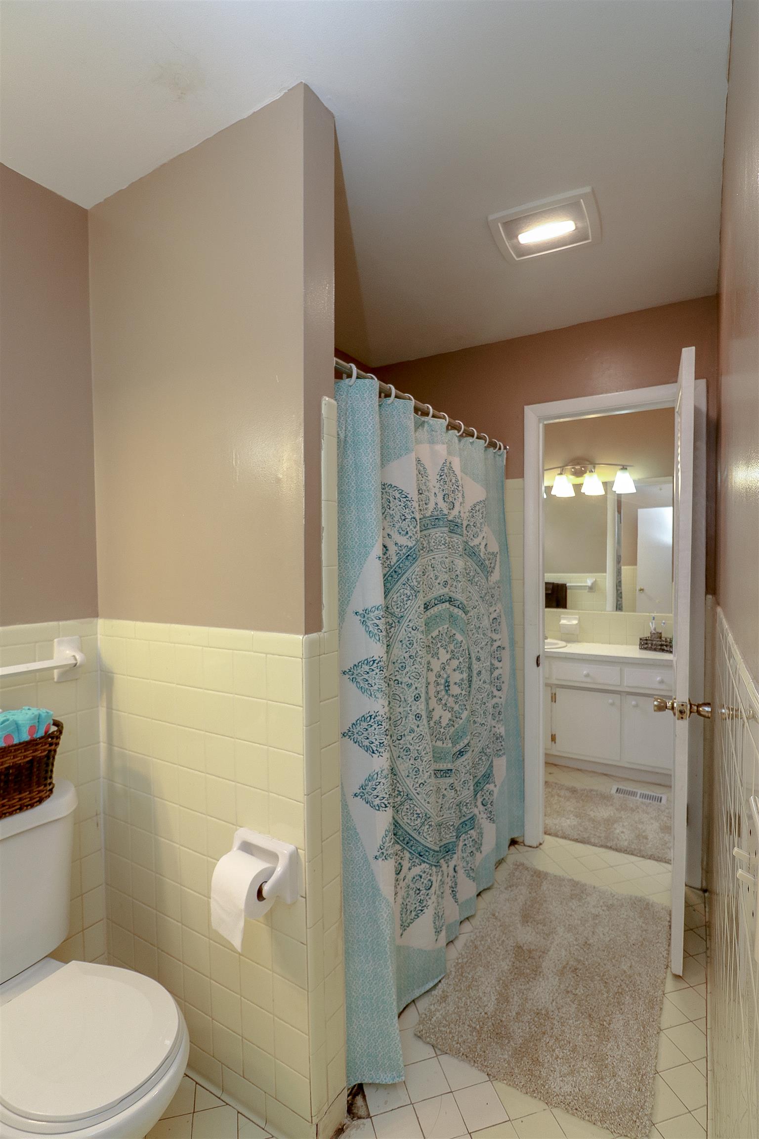 3016 Anderson Road Nashville, TN 37217 - Photo 17 of 25 a bathroom with a granite countertop sink a toilet and shower