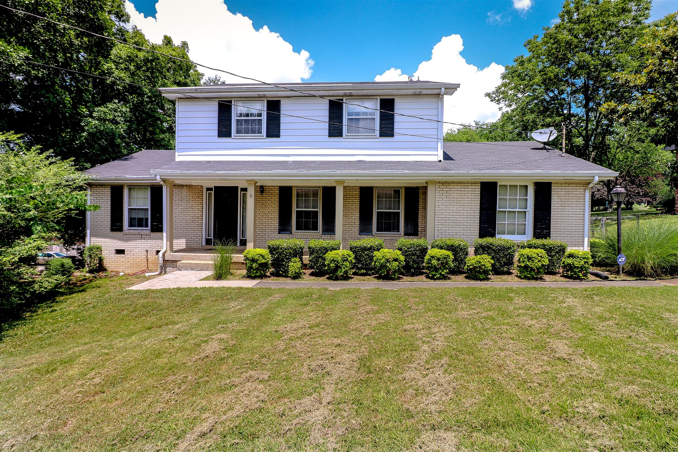 3016 Anderson Road Nashville, TN 37217 - Photo 2 of 25 a view of a house with backyard sitting area and garden