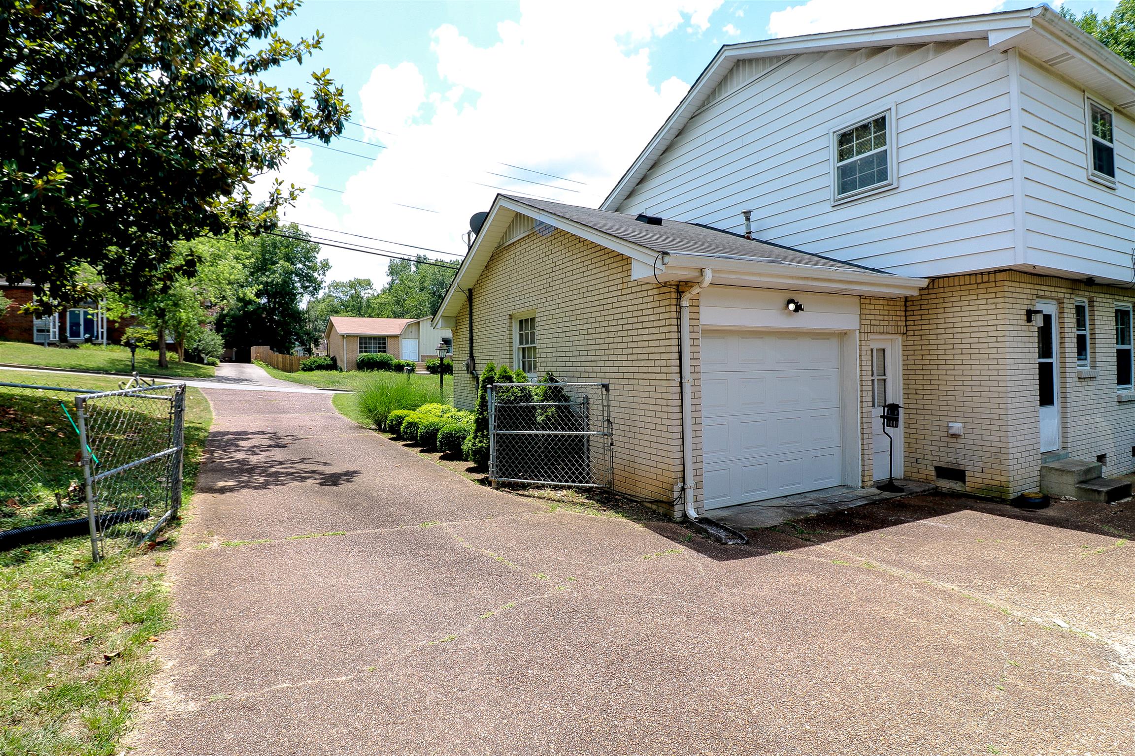 3016 Anderson Road Nashville, TN 37217 - Photo 3 of 25 a view of a house with backyard and trees