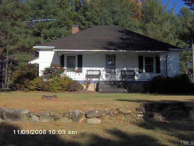 1009 Ridge Road Roxboro, NC 27573 - Photo 1 of 2 a view of a house with garden