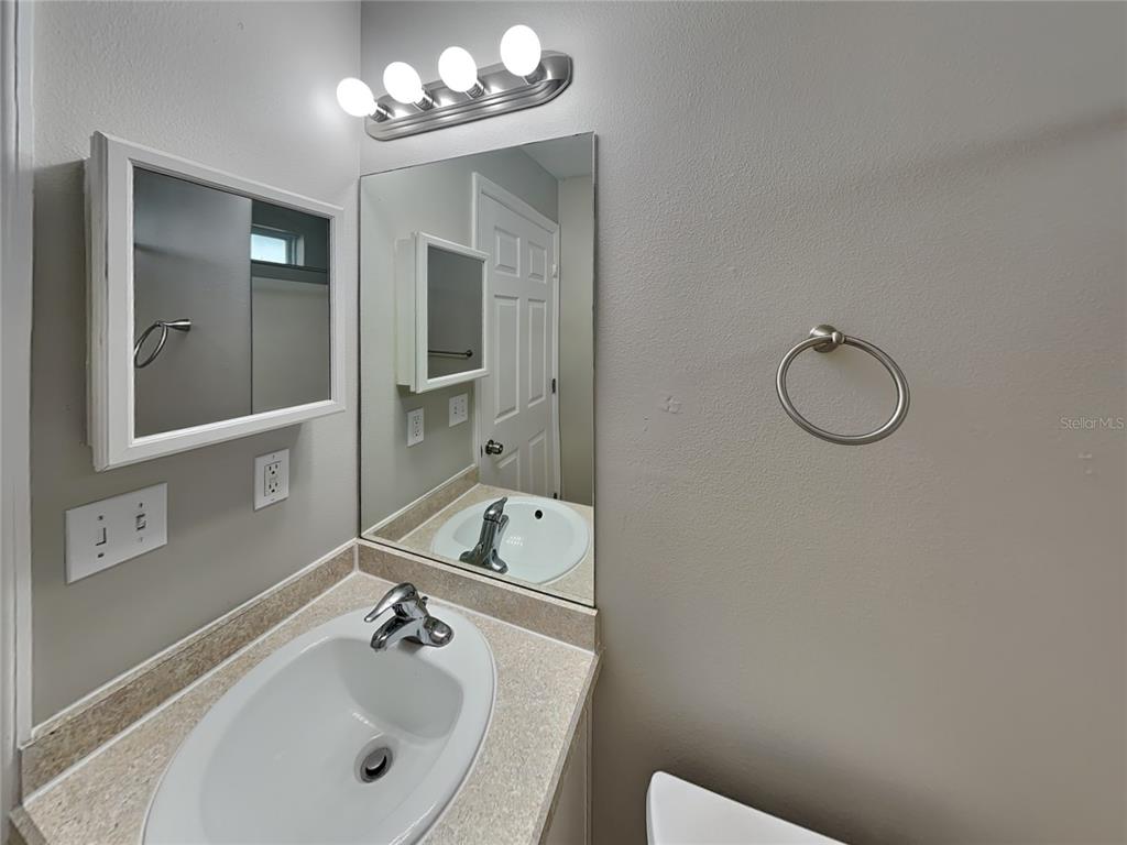 Undisclosed Address Port Orange, FL 32127 - Photo 14 of 16 a bathroom with a sink and a mirror
