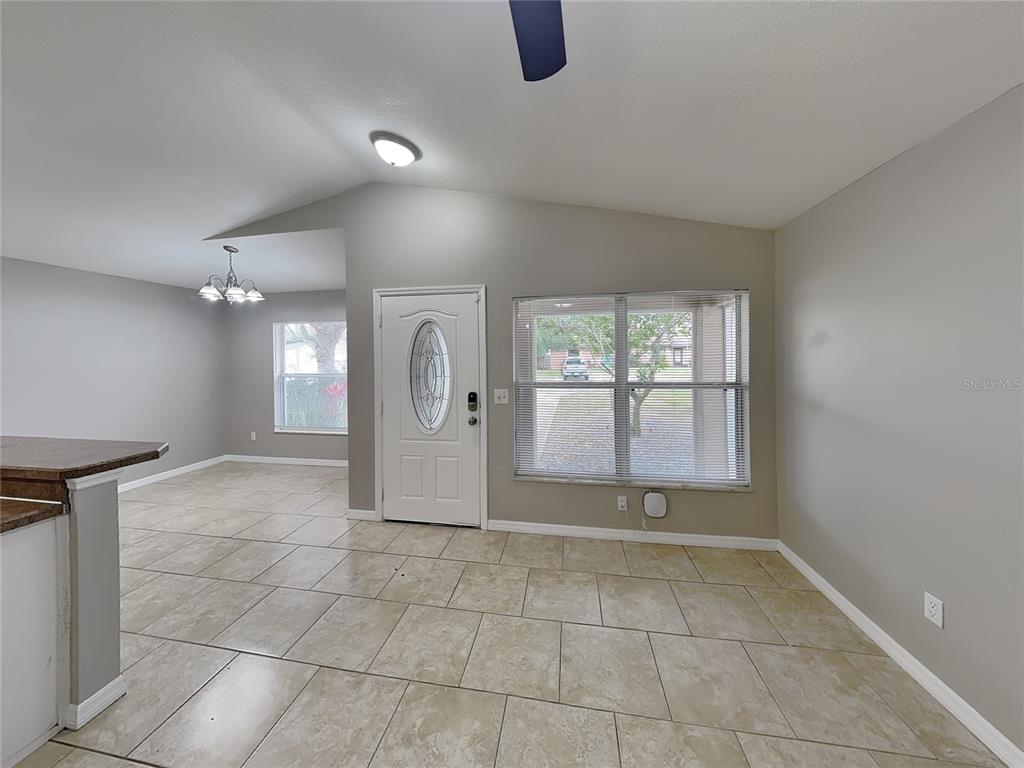 Undisclosed Address Port Orange, FL 32127 - Photo 2 of 16 a view of a livingroom with a staircase