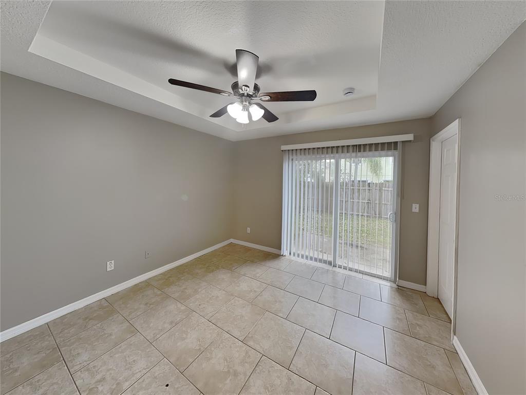 Undisclosed Address Port Orange, FL 32127 - Photo 7 of 16 a view of an empty room with a window