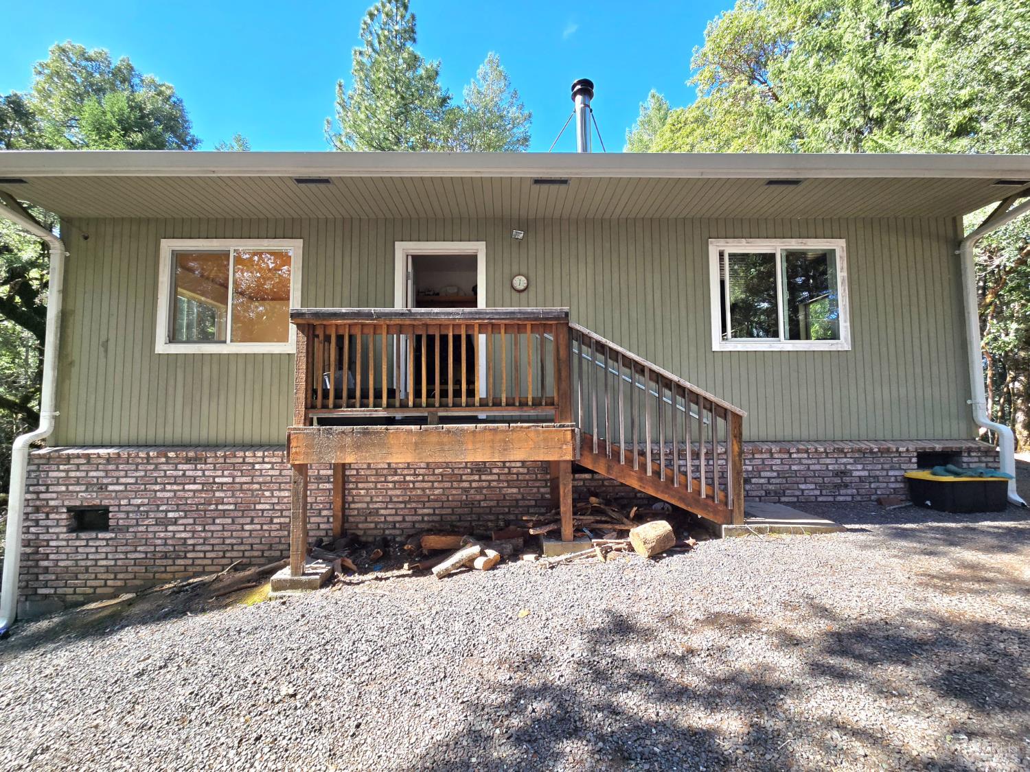 36193 Covelo Road Willits, CA 95490 - Photo 5 of 30 a view of a house with a wooden deck