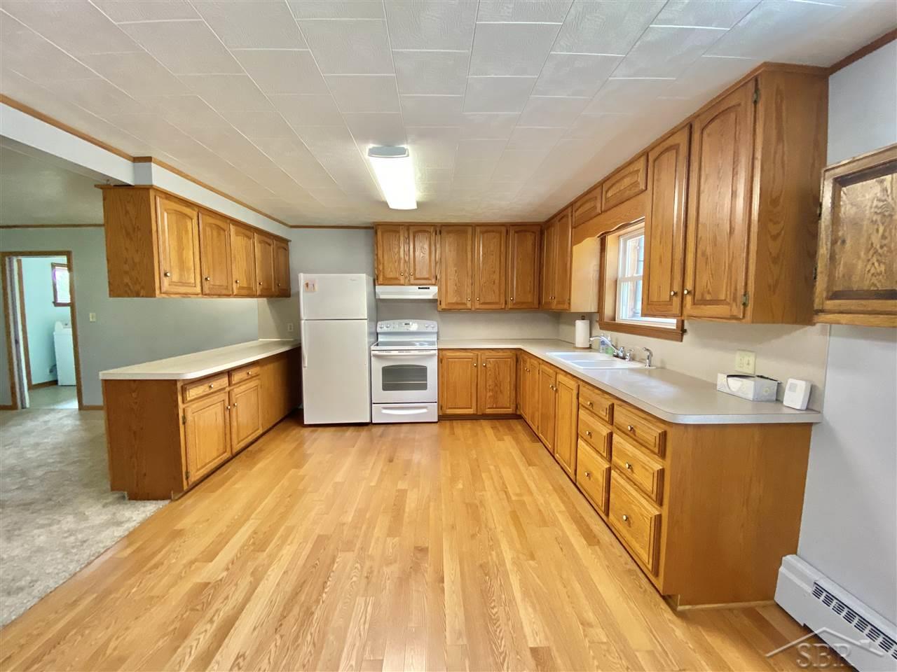 685 South Chapin Road Merrill, MI 48637 - Photo 11 of 43 Kitchen has ceiling height cabinets for extra storage. All appliances included.