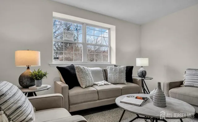a living room with furniture and a window