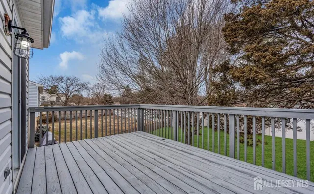 a view of balcony with wooden floor