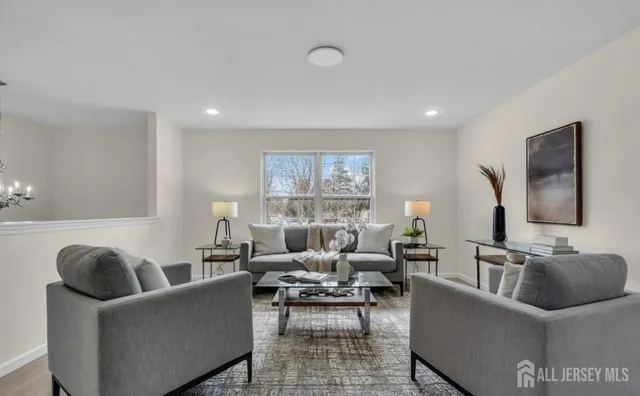 a living room with furniture and a large window