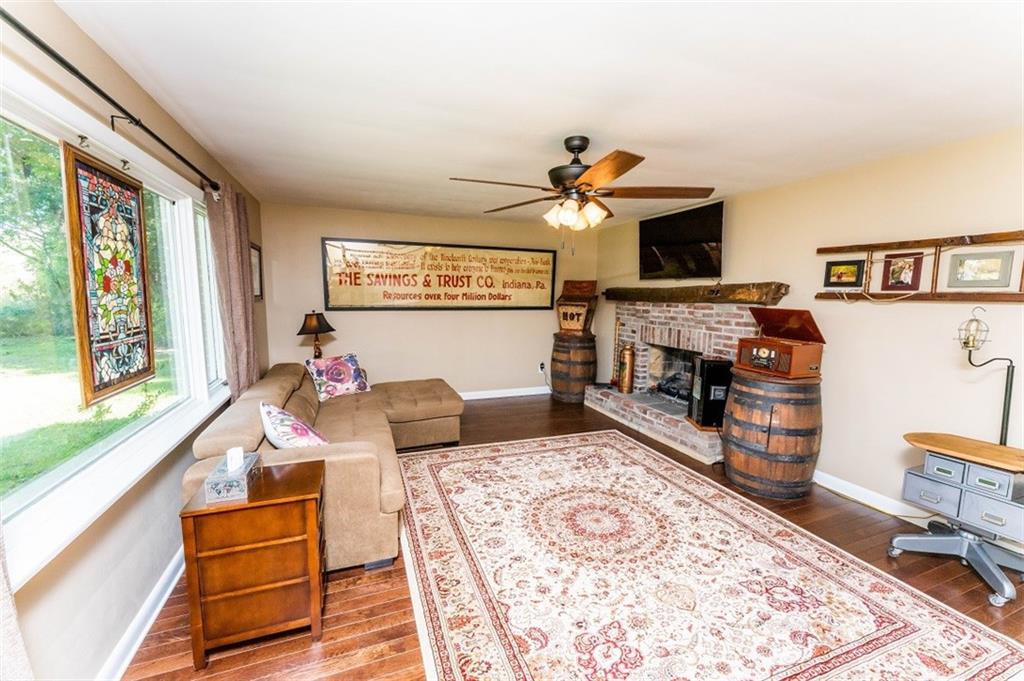 793 Rustic Lodge Road Indiana, PA 15701 - Photo 2 of 22 a living room with furniture and a flat screen tv
