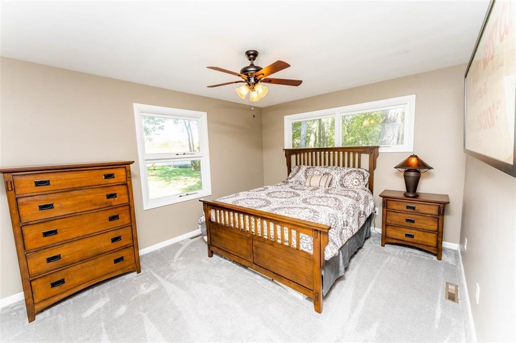 793 Rustic Lodge Road Indiana, PA 15701 - Photo 11 of 22 a bed sitting in a bedroom next to a window