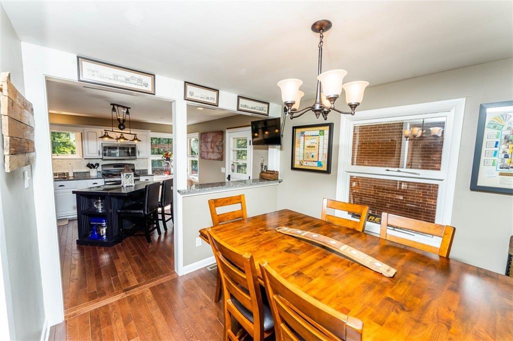 793 Rustic Lodge Road Indiana, PA 15701 - Photo 6 of 22 a dining hall with a dining table chairs and large windows