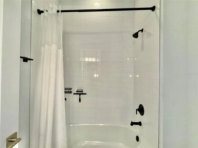 a living room with fireplace furniture and a flat screen tv