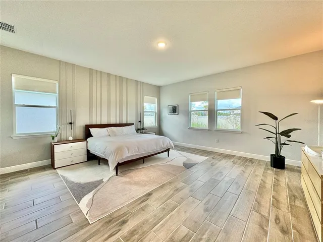 a bathroom with a shower and a sink
