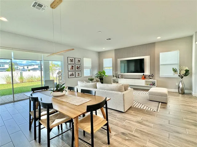 a kitchen with kitchen island granite countertop a sink counter top space cabinets and stainless steel appliances