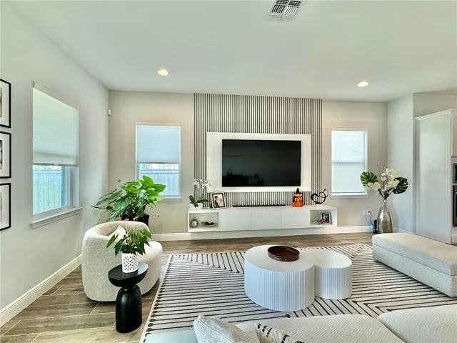 a kitchen with stainless steel appliances granite countertop a sink a stove and cabinets