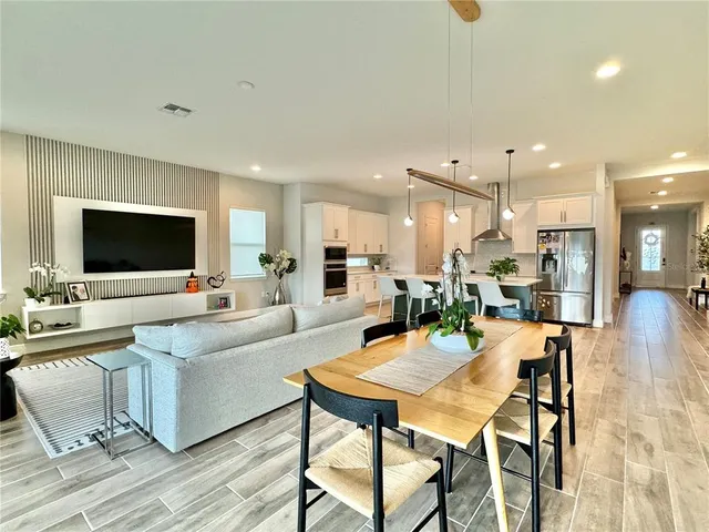 a kitchen with stainless steel appliances granite countertop a stove and a microwave