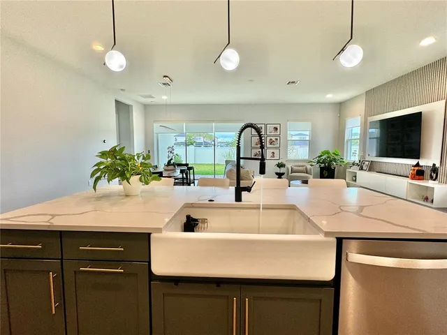 a view of walk in closet with clothes