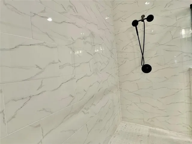 a view of a patio with chairs and plants