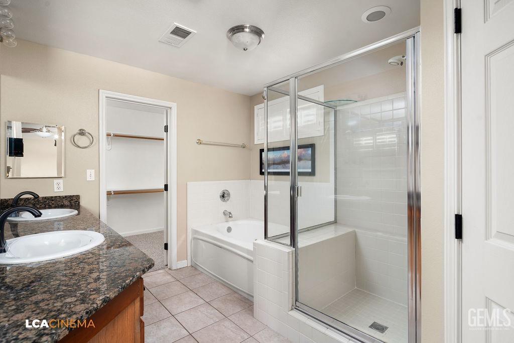 Undisclosed Address Bakersfield, CA 93312 - Photo 17 of 28 a bathroom with a granite countertop sink mirror and shower