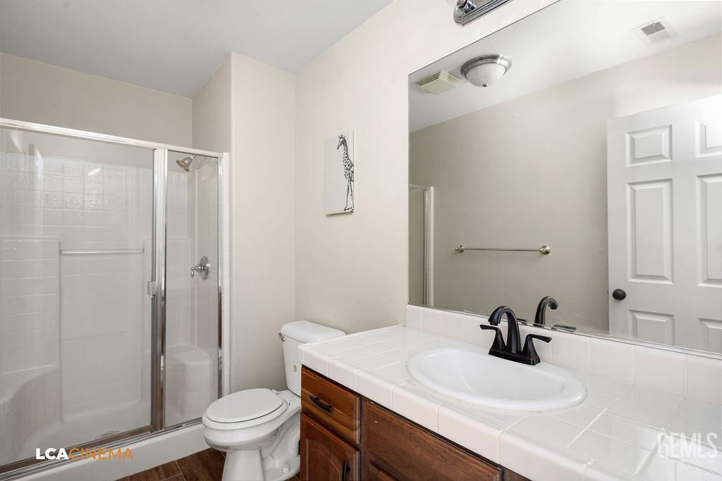 Undisclosed Address Bakersfield, CA 93312 - Photo 24 of 28 a bathroom with a sink toilet and shower