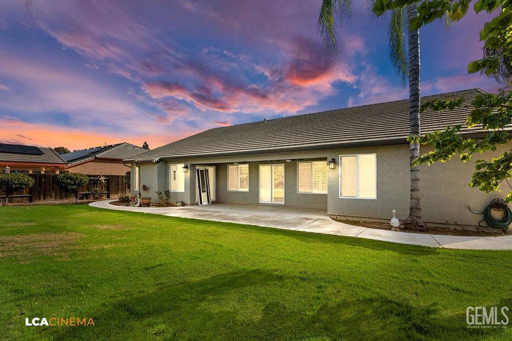 Undisclosed Address Bakersfield, CA 93312 - Photo 25 of 28 a front view of a house with a yard