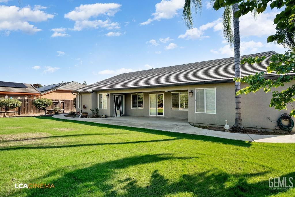 Undisclosed Address Bakersfield, CA 93312 - Photo 26 of 28 a front view of a house with a yard table and chairs