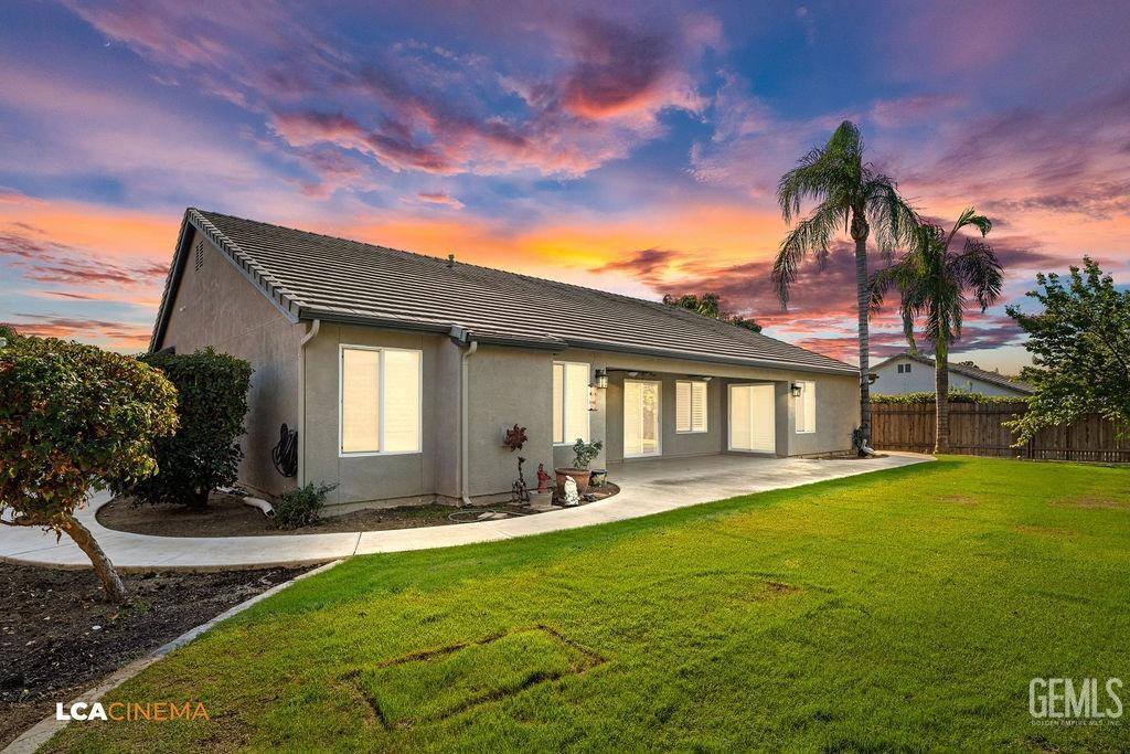 Undisclosed Address Bakersfield, CA 93312 - Photo 27 of 28 a front view of a house with a yard