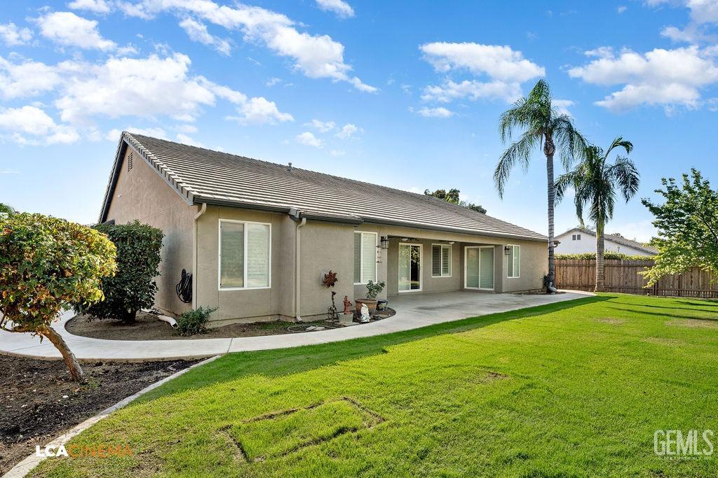 Undisclosed Address Bakersfield, CA 93312 - Photo 28 of 28 a front view of house with yard and outdoor seating