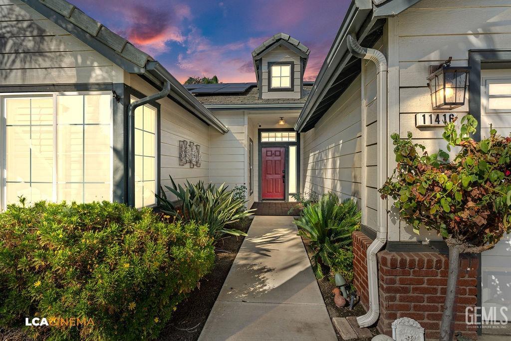 Undisclosed Address Bakersfield, CA 93312 - Photo 4 of 28 a vase of flowers sitting on a floor in front of a house