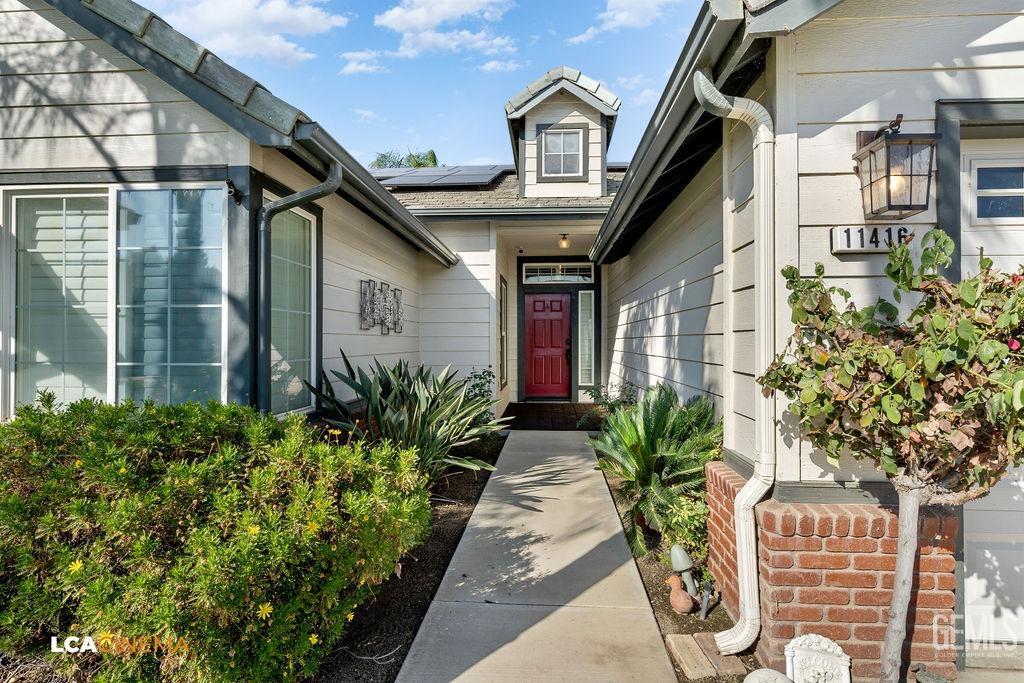 Undisclosed Address Bakersfield, CA 93312 - Photo 5 of 28 a front view of a house with garden