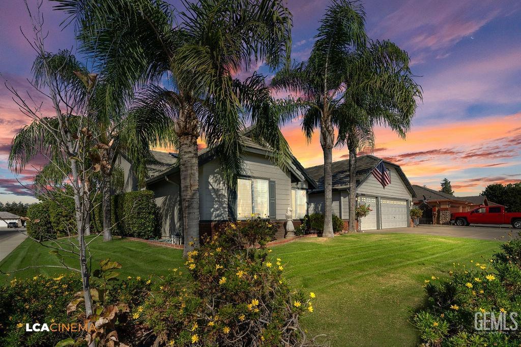Undisclosed Address Bakersfield, CA 93312 - Photo 6 of 28 a front view of house with yard and green space