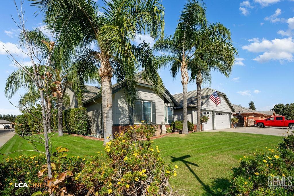 Undisclosed Address Bakersfield, CA 93312 - Photo 7 of 28 a front view of house with yard and green space