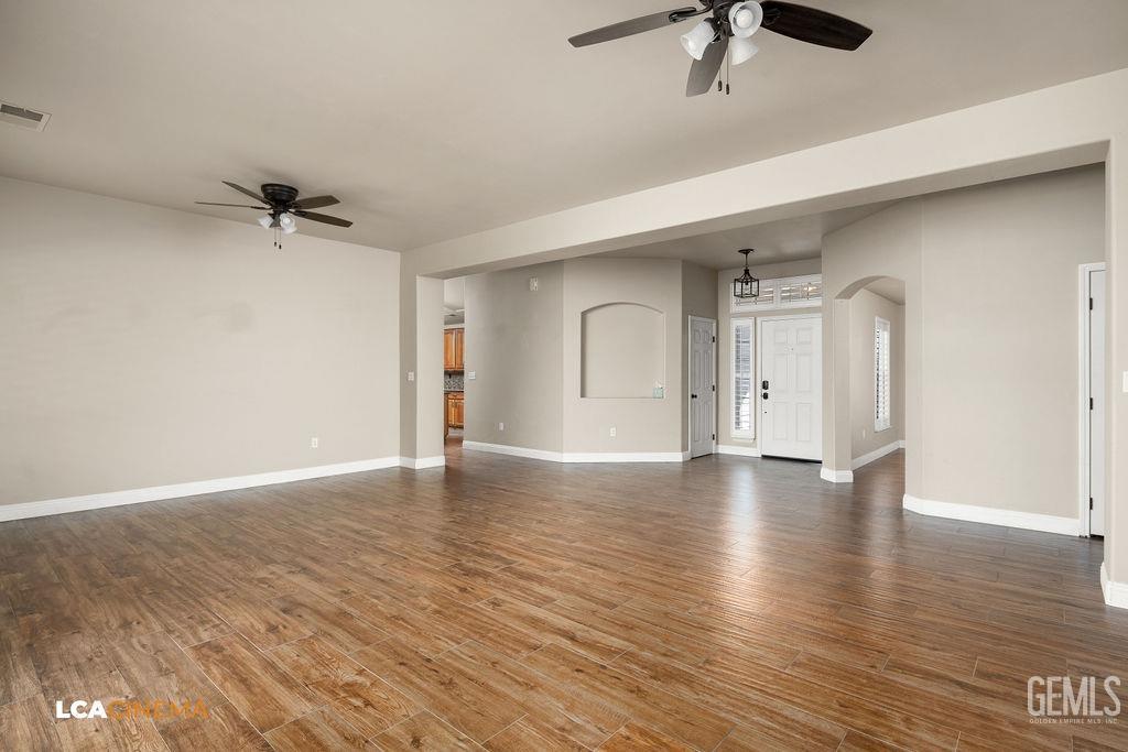 Undisclosed Address Bakersfield, CA 93312 - Photo 8 of 28 a view of a livingroom with a ceiling fan and window