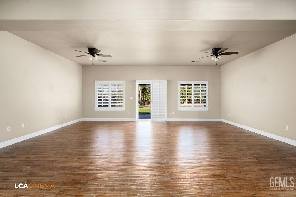 Undisclosed Address Bakersfield, CA 93312 - Photo 9 of 28 wooden floor in an empty room with a window