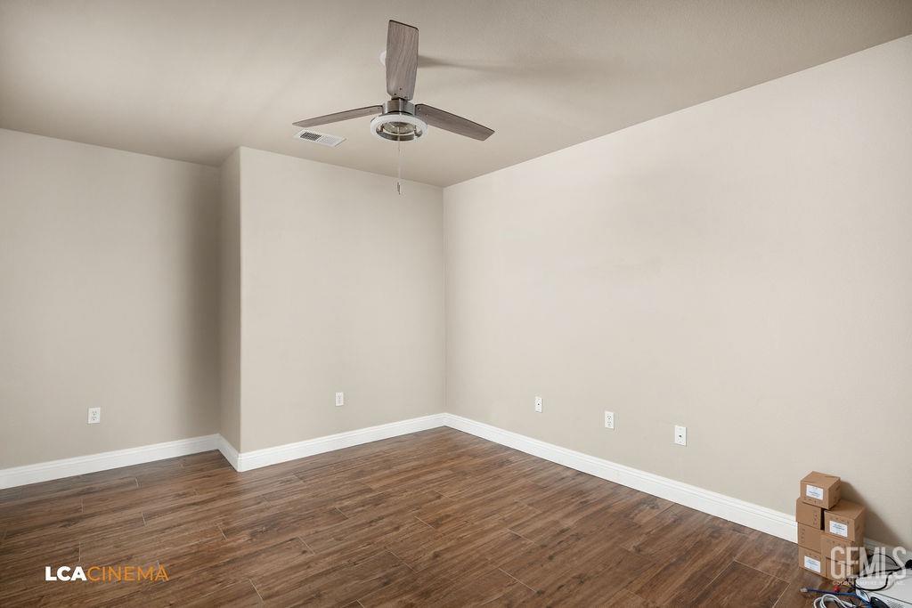 Undisclosed Address Bakersfield, CA 93312 - Photo 10 of 28 a view of an empty room with wooden floor