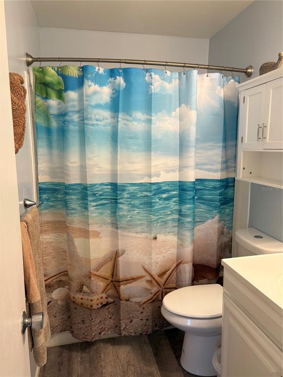 14531 Walsingham Road, Unit 225 Largo, FL 33774 - Photo 11 of 17 a bathroom with a toilet sink and tub