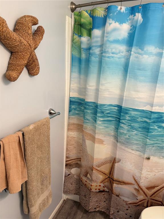 14531 Walsingham Road, Unit 225 Largo, FL 33774 - Photo 13 of 17 a bathroom with a shower