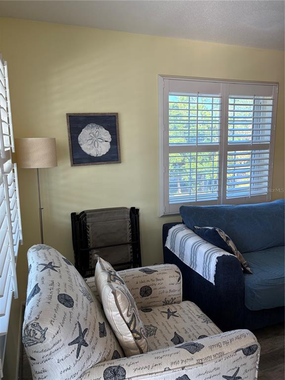 14531 Walsingham Road, Unit 225 Largo, FL 33774 - Photo 6 of 17 a bedroom with a bed and a window